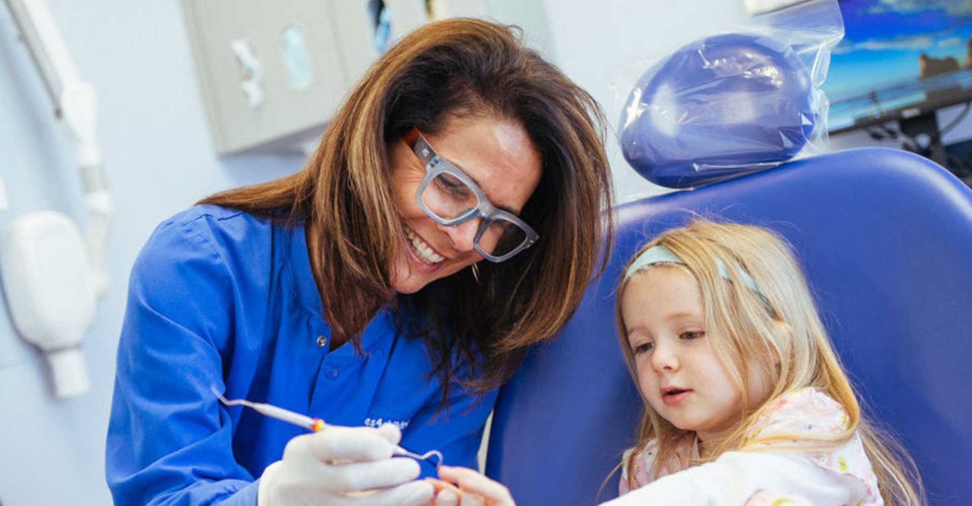 Curious kid looking at dental appliances